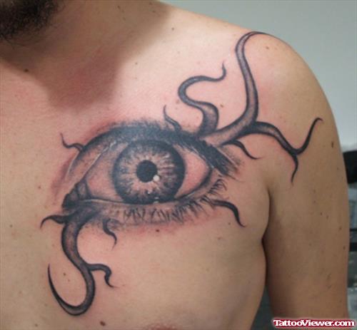 Grey Ink Tribal Eye Tattoos On Man Chest