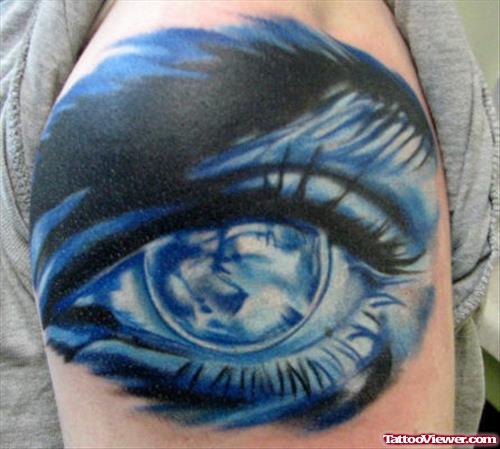 Blue Ink Eye Tattoo On Shoulder