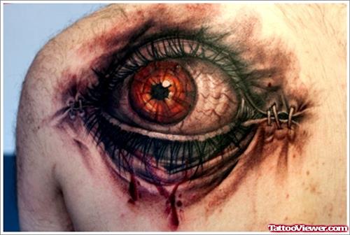 Awesome Colored Eye Tattoo On Back Shoulder