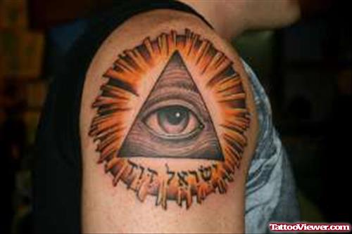 Eye Of God And Hebrew Tattoo On Shoulder