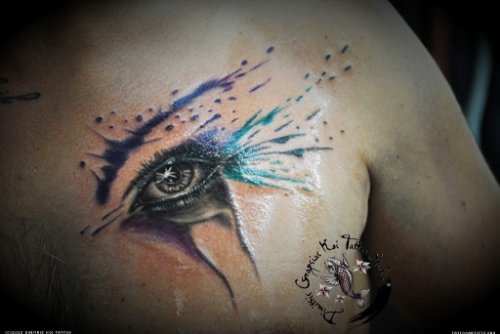 Abstarct Colored Eye Tattoo On Back Shoulder