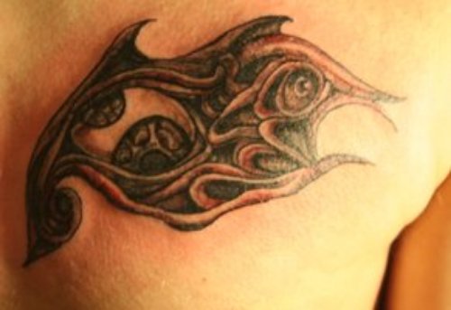 Grey Ink Tribal Eye Tattoo On Right Back Shoulder