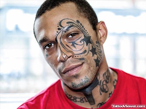 Stars And Tribal Face Tattoo For Men