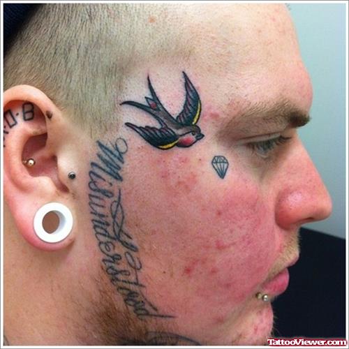Diamond And Flying Swallow Face Tattoo