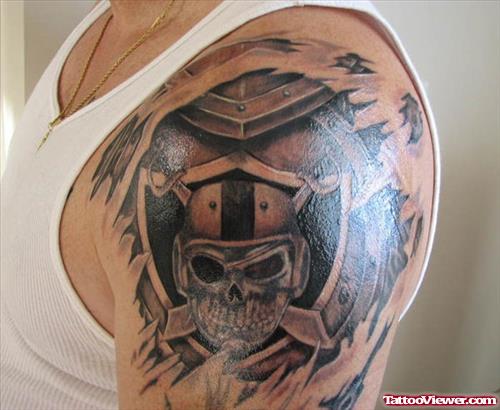 Ripped Skin Raider Face Tattoo On Left Shoulder
