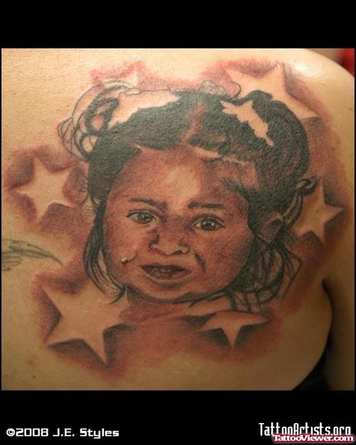 Twinkling Stars And Baby Girl Face Tattoo On Back