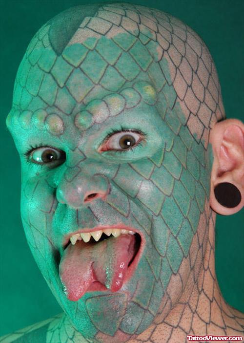 Green Ink Snake Face Tattoo