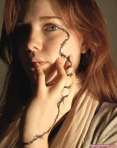 Barbed Wire Hand And Face Tattoo