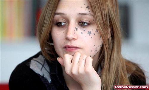 Awesome Black Ink Stars Face Tattoo For Girls