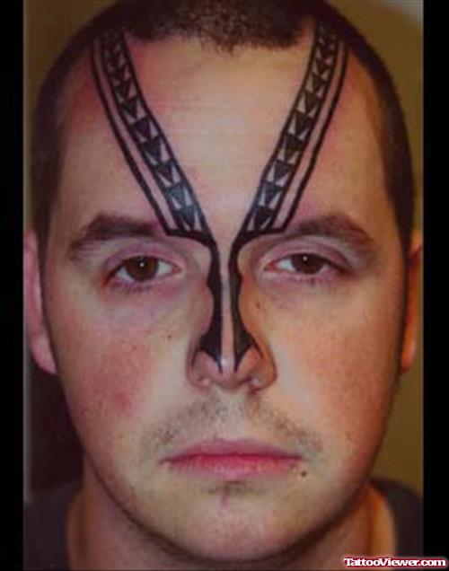Black Ink Tribal Face Tattoo