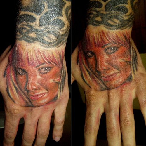 Red Ink Girl Face Tattoo On Hand