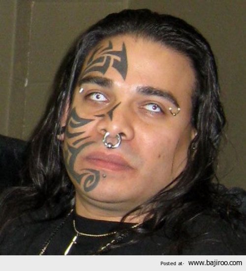 Nice Black Ink Tribal Face Tattoo For Men