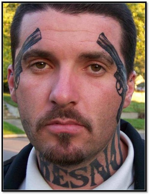 Black Ink Pistols Face Tattoo