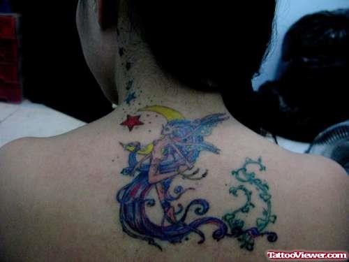 Red Star With Moon And Fairy Tattoo On Upperback