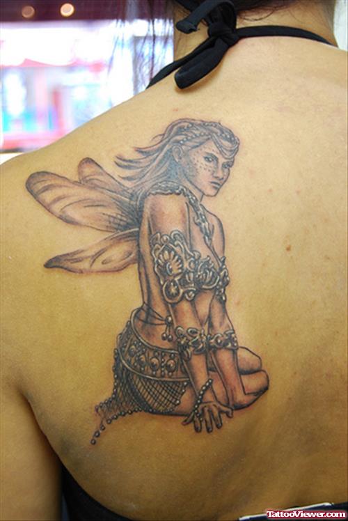 Grey Ink Sitting Fairy Tattoo