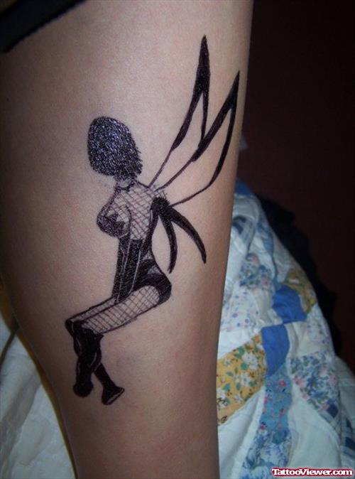 Black Ink Fairy Tattoo On Leg