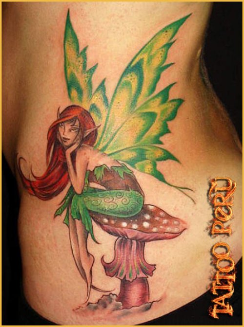 Colored Ink Fairy Sitting On Mushroom Tattoo On Side Rib