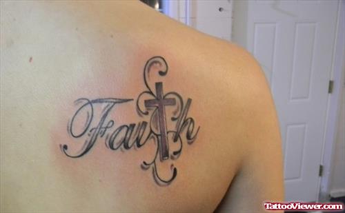 Grey Ink Cross Faith Tattoo On Back Shoulder