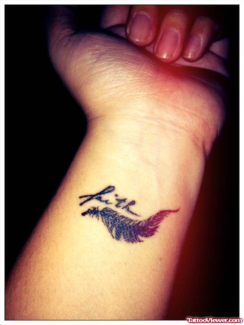 Feather And Faith Tattoo On Left Forearm