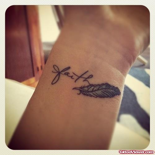 Grey Ink Feather And Faith Tattoo On Wrist