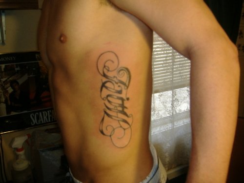Grey Ink Faith Tattoo On Left Side Rib
