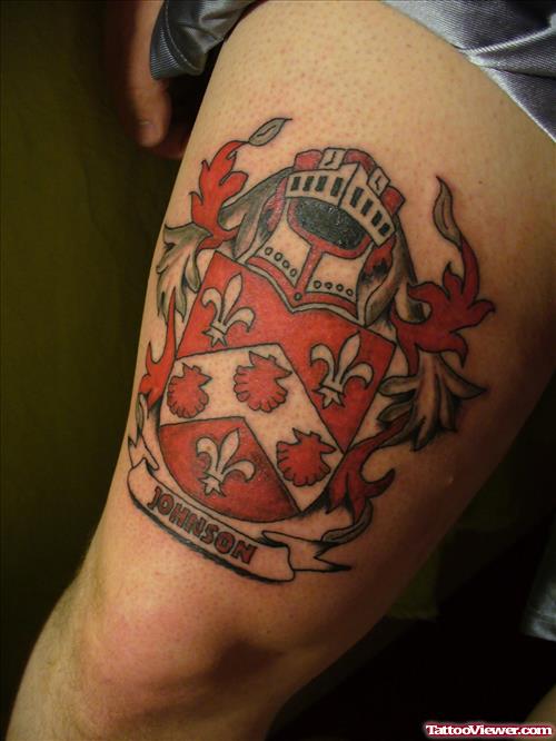 Red Ink Family Crest Tattoo On Thigh