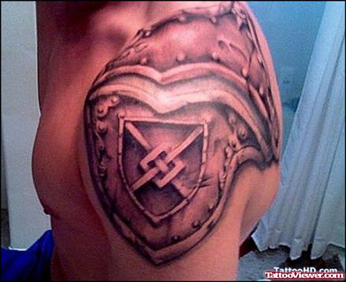 Grey Ink Armor Family Crest Tattoo On Left Shoulder