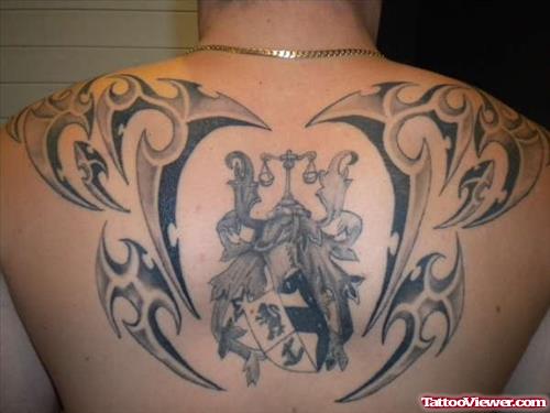 Amazing Grey Ink Tribal And Family Crest Tattoo On Upperback
