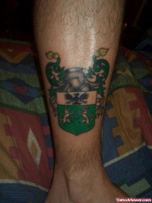 green-ink-family-crest-tattoo-on-leg.jpg