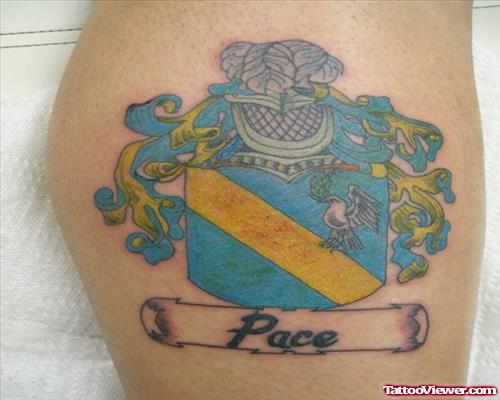 Attractive Blue Ink Family Crest Tattoo