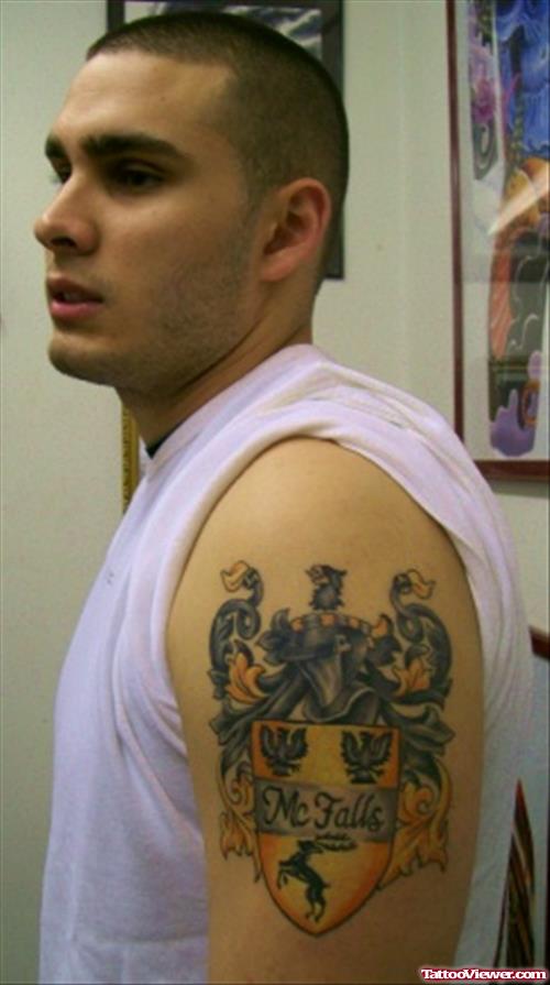 Colored Family Crest Tattoo On Left Half Sleeve