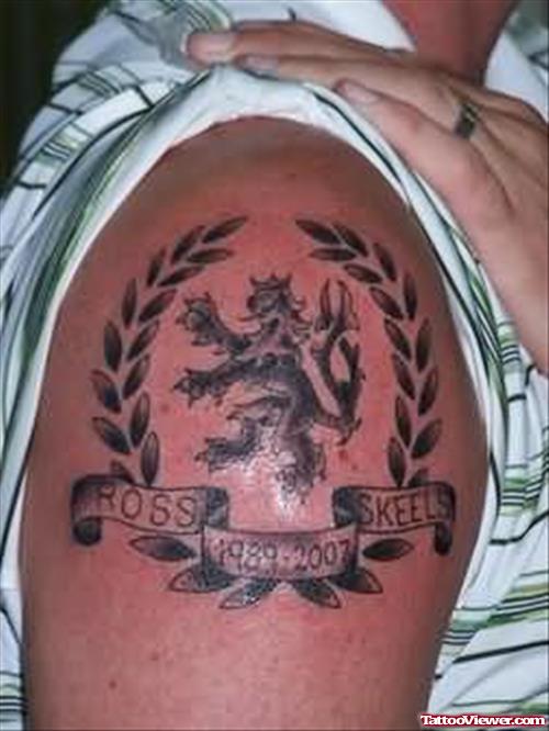 Family Crest Tattoo On Muscle