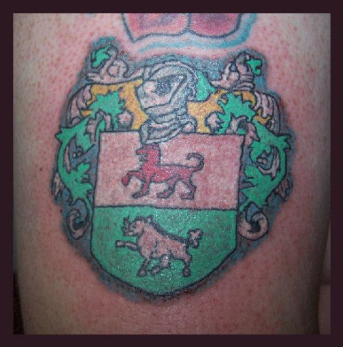 Awesome Colored Family Crest Tattoo For Men
