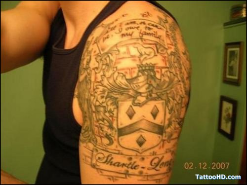 Awesome Grey Ink Family Crest Tattoo On Left Shoulder