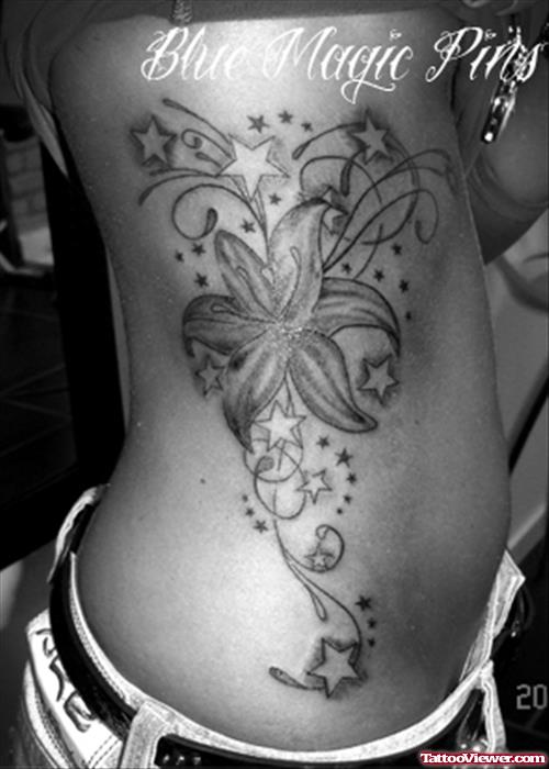 Stars And Flower Fantasy Tattoo On Side Rib