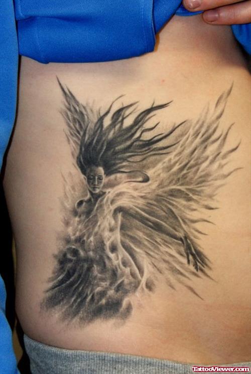 Grey Ink Fantasy Tattoo On Hip