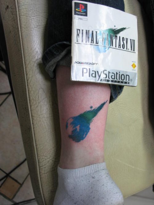Blue Ink Fantasy Tattoo On Leg