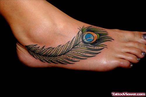 Fantastic Colored Peacock Feather Tattoo On Girl Right Foot