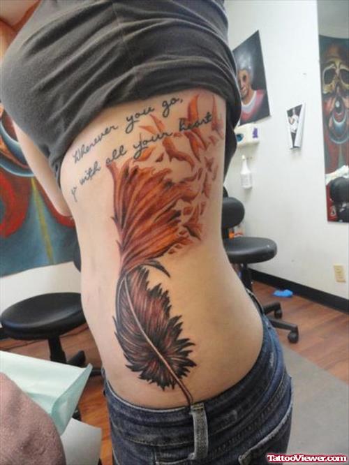 Amazing Colored Feather Tattoo On Rib