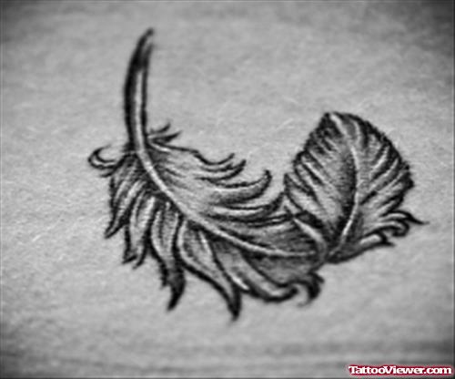 Grey Ink Feather Tattoo