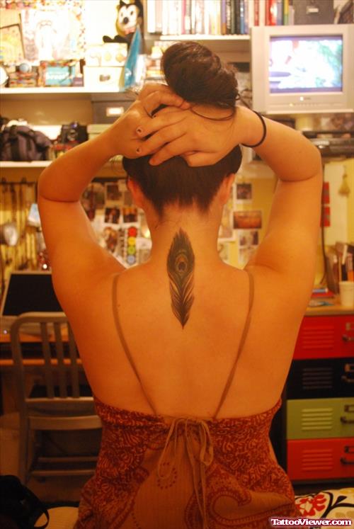 Peacock Feather Tattoo On Girl Upperback