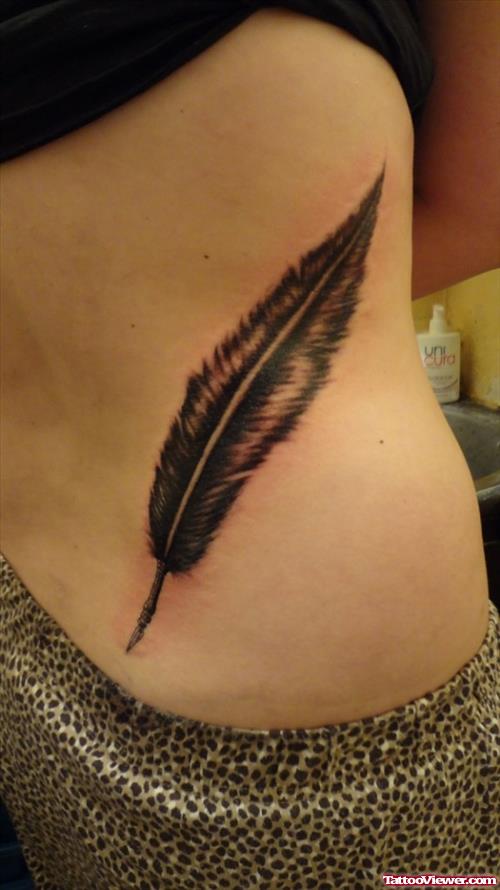 Simple Girl Rib Feather Tattoo