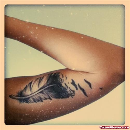 Left Bicep Feather Tattoo