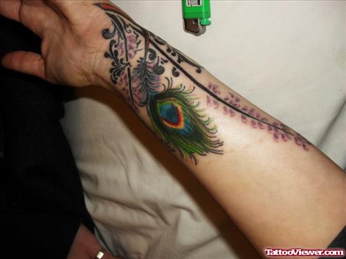 Crazy Left Arm Colored Peacock Feather Tattoo