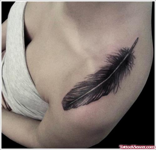 Black Feather Tattoo On Girl Left Shoulder