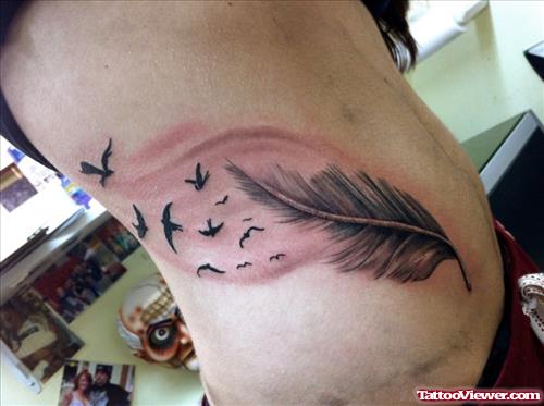 Amazing Flying Birds Feather Tattoo
