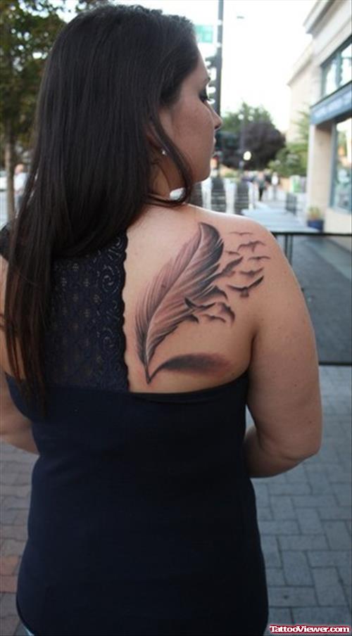 Grey Ink Feather Tattoo On Girl Right BAck Shoulder