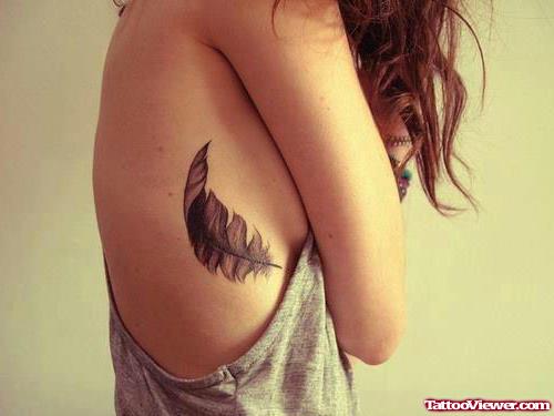 Girl Rib Feather Tattoo