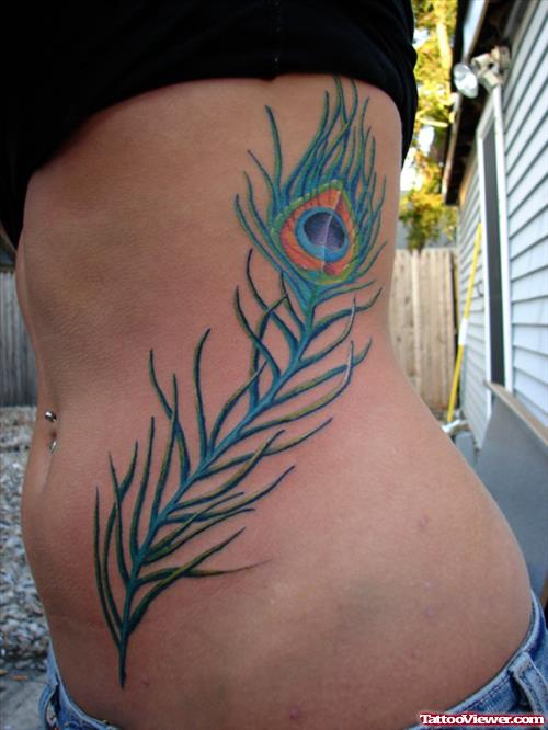 Blue Ink Peacock Feather Tattoo On Rib Side