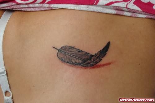 Tiny Feather Tattoo